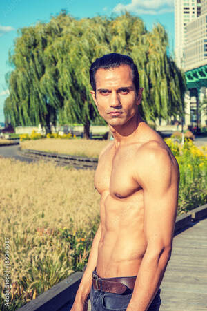 east indian american nude - Young East Indian American Man, half naked, showing strong body, standing  at park in New York under sun, serious, looking forward, . Photos | Adobe  Stock
