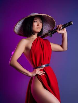 hand naked asian babes - Premium Photo | The nude slender asian woman in a red cape and an asian hat  with a katana in her hand image of a samurai on a neon background