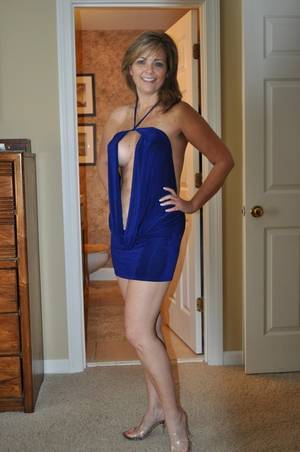 Blue Dress Milf - Lovely milf in a sexy blue dress. She loves to check the mail and tease all  the neighbor men.
