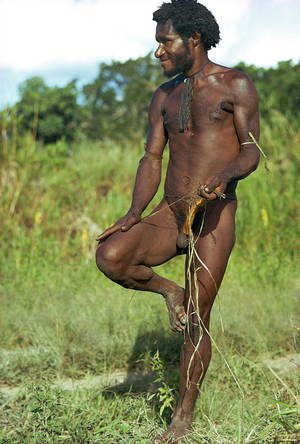 native african dick - A Dani man, naked except for a penis gourd, in the Highlands of Papua