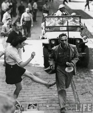 French Nazi Collaborators Women Porn - WW II - French woman vents her anger towards a German POW with a kick as