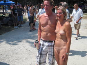 clothed girl looks at nudist - Clothed male, naked female