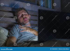 cyber sex movie - Man Alone in Bed Playing Cybersex Using Laptop Computer Watching Sex Movie  Late at Night with Lascivious Pervert Face Stock Image - Image of  masturbation, adult: 134655025