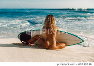beach girls naked webcam - Naked surf girl with surfboard on ocean beach.... - Stock Photo [69239236]  - PIXTA