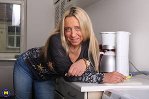 german blonde milf - Sexy blonde German mother, playing with a cucumber. - Mature.nl