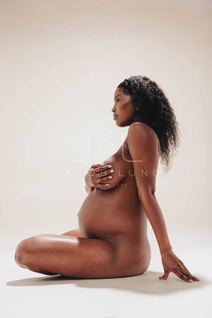 african american pregnant nude - Naked, dark-skinned pregnant woman embracing her maternity body in stu â€“  Jacob Lund Photography Store- premium stock photo