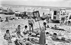 1970s nudist porn - Puritan picket against too revealing swimwear on a Florida beach, 1985. USA  â€œYou will follow to Hell.â€ [800x513] : r/HistoryPorn