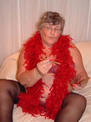 fat smoking granny - Granny smoking a cigar and showing her pussy