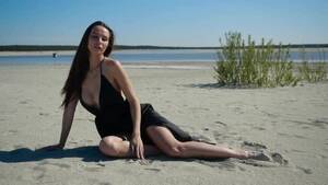 naked beach girls videos - Charming Girl in Black Dress Slightly Covering Naked Body Sits on the Beach,  Stock Footage