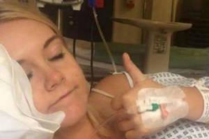 cam girl sex toy seat - Emma offers a thumb's up from her hospital bed (Image: Facebook)