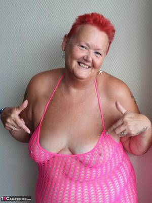 fat red granny - Fat nan with short red hair finger spreads her pussy on oceanside balcony -  PornPics.com