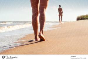 model walking on beach naked - nude young girls walk on the beach in the waves of the surf - a Royalty  Free Stock Photo from Photocase