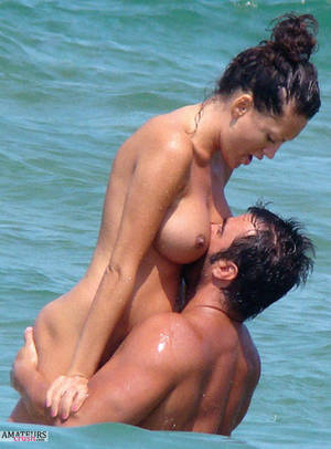 beach juicy boobs - Man motorboating his big juicy girlfriends tits in the waters