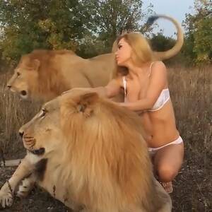 Katya Sambuca Russian Porn Star - Porn star Katya Sambuca poses semi naked straddling two LIONS that were  snarling and snapping in discomfort sparking animal rights outrage | The Sun