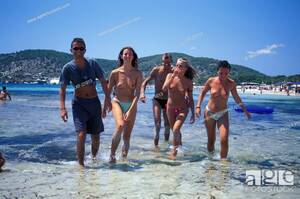 ibiza topless beach celebrities - Group of young men and women on the beach, Sa Trincha, Platja de ses  Salines, Ibiza, Stock Photo, Picture And Rights Managed Image. Pic.  LKF-21013 | agefotostock