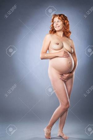 blue pregnant lady naked - beauty nude pregnant woman on gray background Stock Photo - 28221427