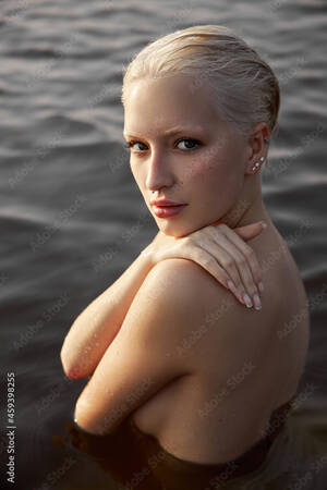 large beautiful breasts nude - Foto de Nude naked sexy woman in water at sunset. Beautiful blonde woman  with short wet hair and big breasts, art portrait in sea do Stock | Adobe  Stock