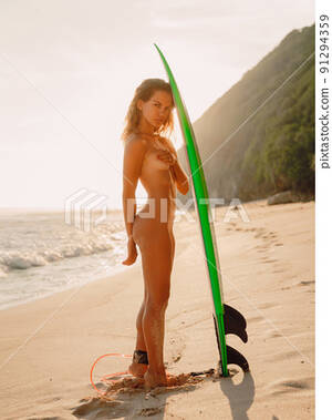 beach girls naked webcam - Naked attractive surf girl standing with... - Stock Photo [91294359] - PIXTA