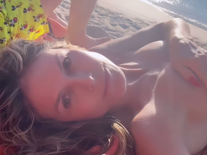 naked beach self shot - Heidi Klum Avoids Tan Lines by Going Topless and Makeup-Free in St. Barts |  Glamour