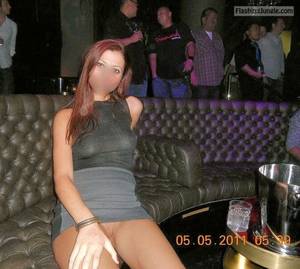 flashing upskirt in club - Pantyless redhead in night club separe