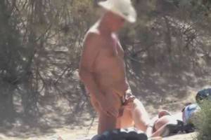 naked beach wank - Busty MILF watches 2 guys jerk off on nude beach