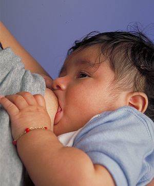 lactating open legs - Breastfeeding