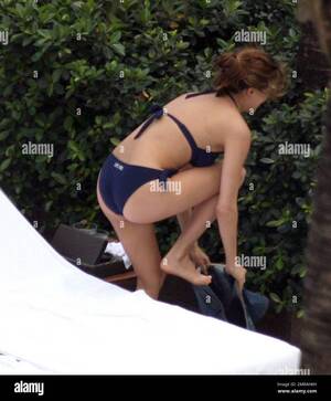 Melissa Theuriau Body Xxx - Exclusive!! Jamel Debbouze and his adoring wife Melissa Theuriau spend a  romantic day by the pool cuddling and kissing. The new parents, who had a  son on 3 December 2008 called Leon,