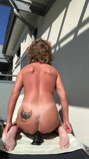 Danish Milf - Danish MILF rides dildo anally on balcony - ThisVid.com