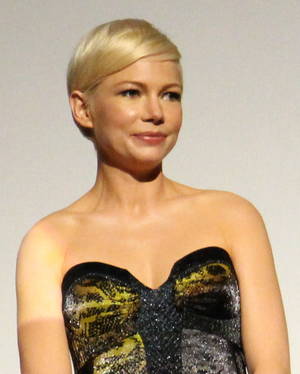 lesbian spy cam in bathroom - An upper body shot of Michelle Williams as she looks away from the camera