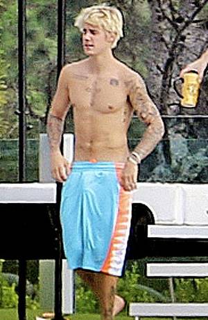 Justin Bieber Booty Porn - Justin Bieber is once again attempting to prove he is packing by walking  around commando in a pair of sky blue shorts for the paparazzi.