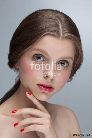 Beautiful Young Girl - Beautiful attractive young girl model looking at camera posing in studio.  Nude natural fresh makeup