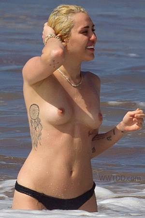 celebrity beach fuck - Here is Miley Cyrus topless wearing only her bikini bottoms and enjoying  the surf at the beach in Hawaii. Miley Cyrus seems to be goin.