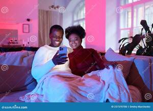 black funny videos - African Couple Relax on Sofa with Smartphone at Home, Friends Watch Funny  Videos on Mobile Phone Stock Photo - Image of couch, call: 237370708