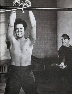Elvis Presley Nude Porn - â€œElvis Presley, after participating in a prison riot, suffers the severe  punishment dealt out by a guard (Bill Hickman) in Richard Thorpe's  Jailhouse Rock .