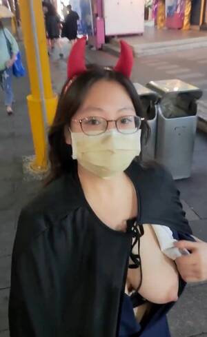 asian party boobs - Lustful Asian girl showed boobs in a crowded place in honor of the  celebration of Halloween.