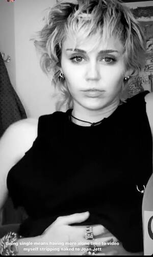 Miley Cyrus Black Blowjob - Miley Cyrus strips, grabs her chest, unbuttons pant, post break up is  unappreciated by followers - IBTimes India