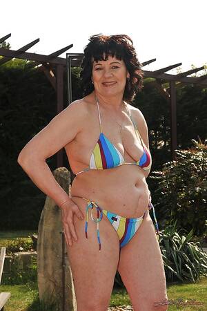 chubby bikini mature older - Chubby mature brunette Helena May slipping off her bikini outdoor - PornPics