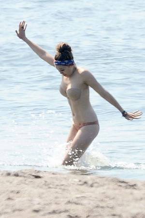 elizabeth olsen topless beach - elizabeth olsen bikini | Elizabeth Olsen frolics and freezes in a  flesh-colored bikini .