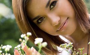 charming asian girl - Charming asian girl in sexy black mini-skirt shows her sexy legs outdoors