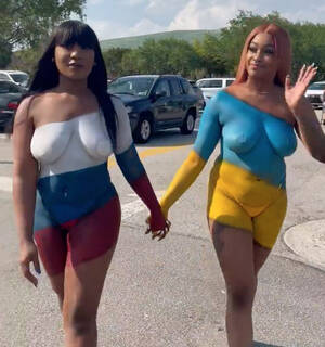 body painting nudist camp video - Instagram models slammed for nude video wearing Ukrainian and Russian flag body  paint - Need To Know
