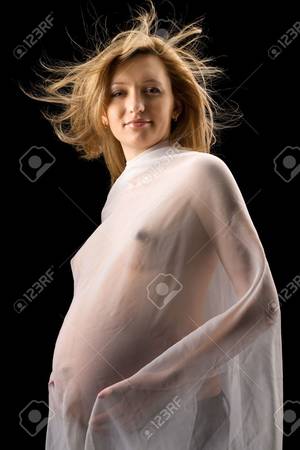 beautiful naked pregnant ladies - beautiful naked pregnant girl in an easy transparent fabric, isolated on  black background Stock Photo