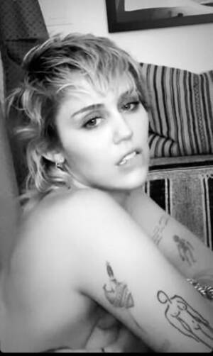 Miley Cyrus Black Blowjob - Miley Cyrus strips, grabs her chest, unbuttons pant, post break up is  unappreciated by followers - IBTimes India