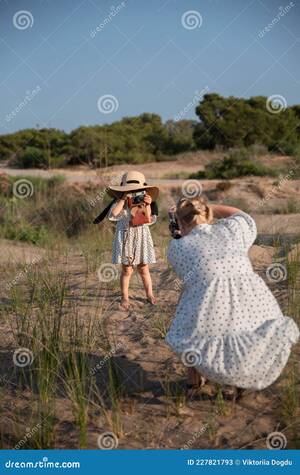 beach mother naked - Mom and Daughter are Photographed on the Beach Stock Image - Image of  portrait, female: 227821793