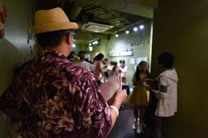 free japanese erotic junior idols - A man looks at an idol singer at a concert in Tokyo on July 29,