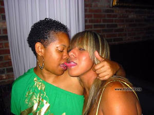 ebony girls kissing - Young African American high school girls kissing in front... Big-size  picture #2
