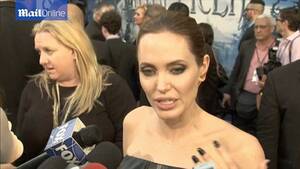 Angelina Jolie Porn Ebony - Angelina Jolie wears leather gown at Maleficent premiere with Brad Pitt |  Daily Mail Online