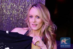 English Gentleman Porn - Adult-film actress Stephanie Clifford, also known as Stormy Daniels, poses  for pictures at the end of her striptease show in Gossip Gentleman club in  Long ...