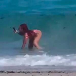 beuty nude beach hidden cam - Influencer posing for butt snap on Miami beach given 'enema' by surprise  wave - Daily Star