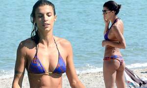 Elisabetta Canalis - Elisabetta Canalis shows off her washboard abs as she emerges from the sea  | Daily Mail Online