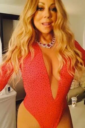 mariah carey upskirt - Mariah Carey rocks a VERY plunging red bodysuit and thigh high split skirt  as she performs in Mexico - Mirror Online